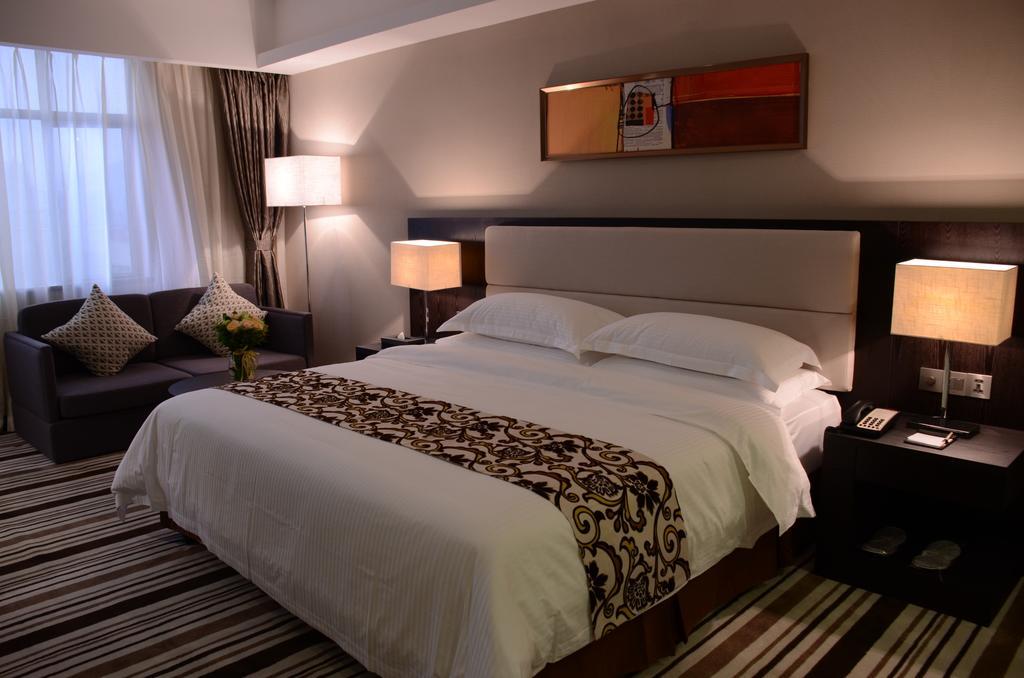 Dongguan Junyue Hotel Zimmer foto